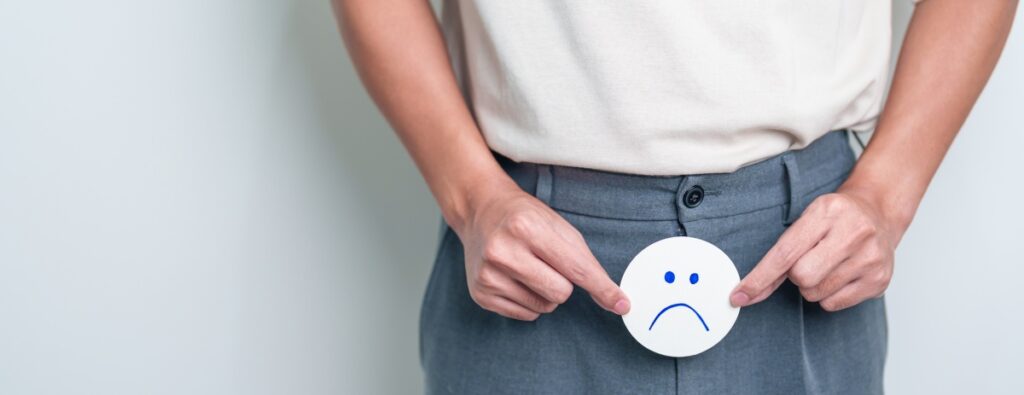 massaggio prostatico, uomo con emoji triste davanti alla cintura